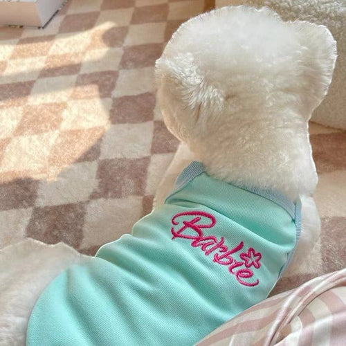 The Spoiled Pet Club light blue acrylic fiber dog tank top with pink Barbie logo and flower detail.