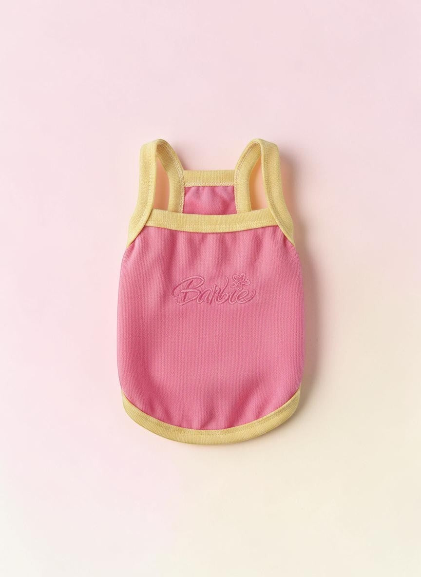 The Spoiled Pet Club pink Barbie dog tank top with yellow trim and embroidered logo, made from soft acrylic fiber.