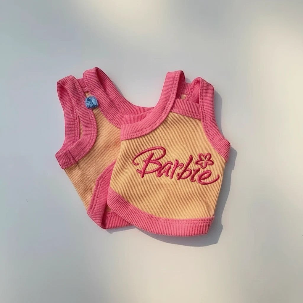 The Spoiled Pet Club Barbie tank top for dogs, yellow with pink trim and Barbie logo.