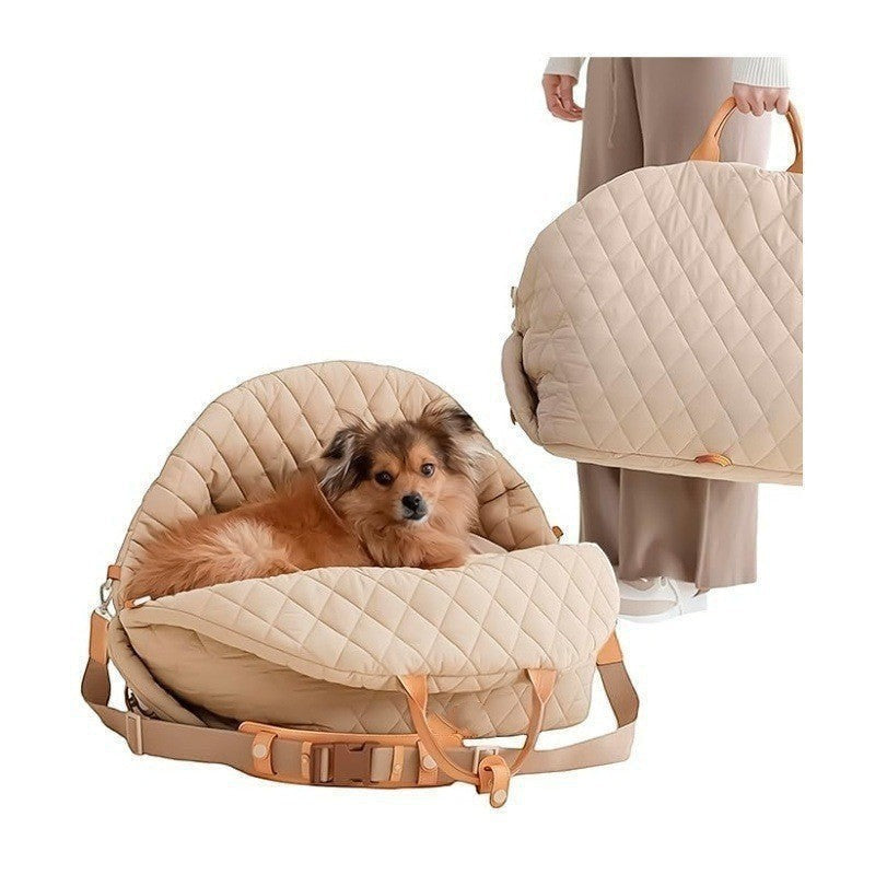 The Spoiled Pet Club beige quilted nylon pet carrier bag with a small dog resting inside and a hand-carry strap.