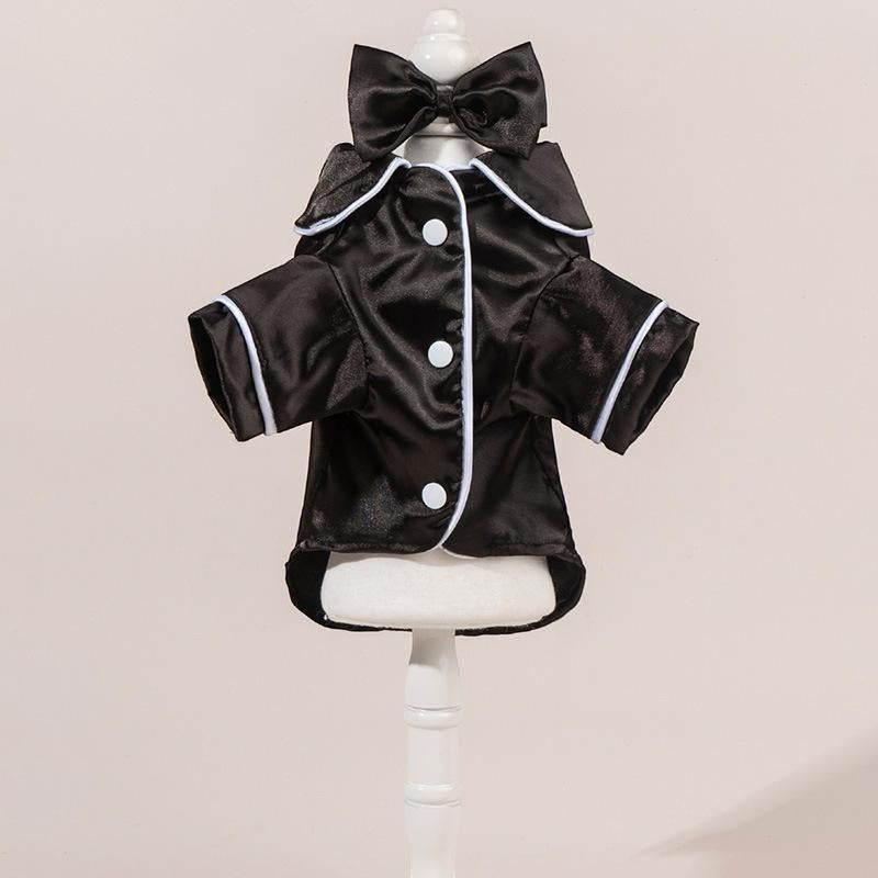 The Spoiled Pet Club black satin pajama shirt with white trim and bow detail. Short sleeves, button front.