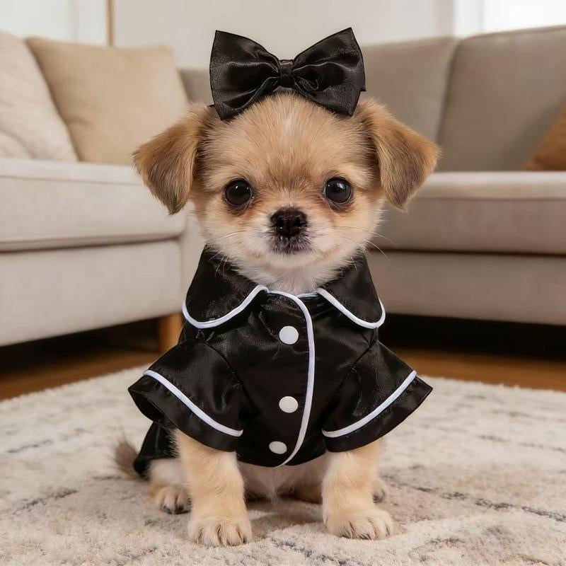 The Spoiled Pet Club black satin pajama shirt with white piping and bow detail on a puppy.