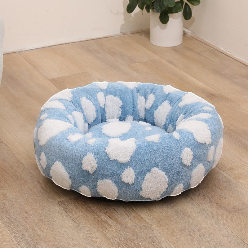 The Spoiled Pet Club round blue and white cloud-patterned polyester pet bed for cozy nesting