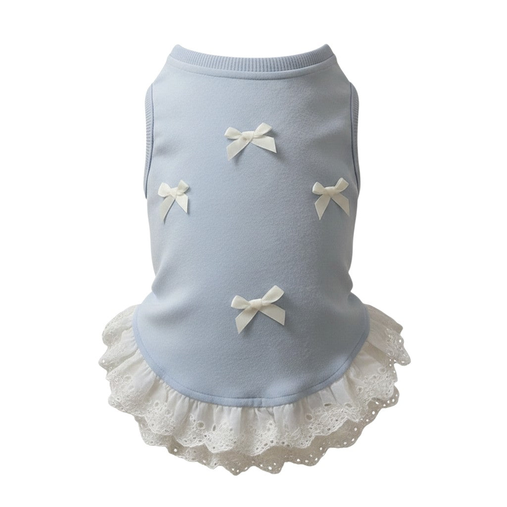 The Spoiled Pet Club blue dog pullover vest with white bows and a delicate lace trim hem for a stylish look.