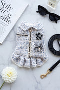 The Spoiled Pet Club Dahlia Darling tweed dog dress in blue and white with pearl trim, bow, and floral embellishment.