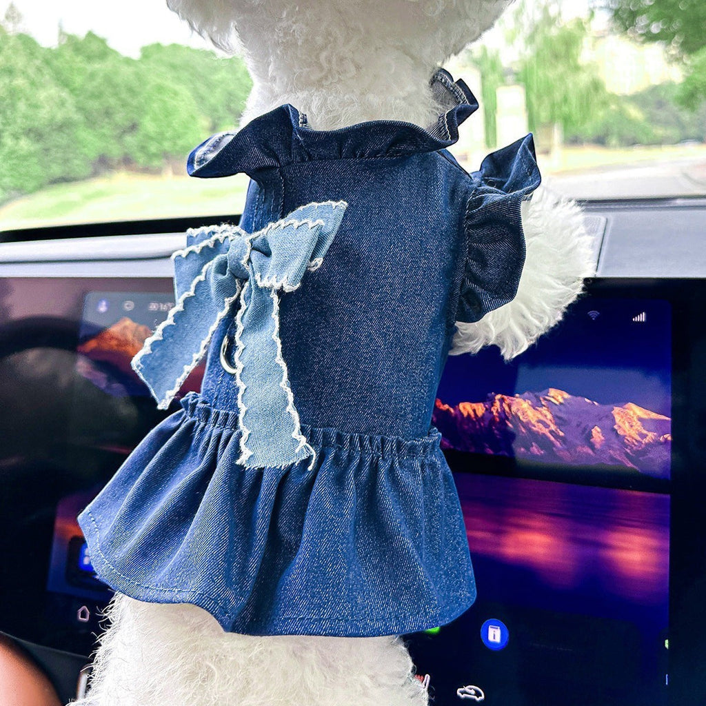 The Spoiled Pet Club denim pet dress with a ruffled collar, sleeves, and a large bow detail for small dogs.