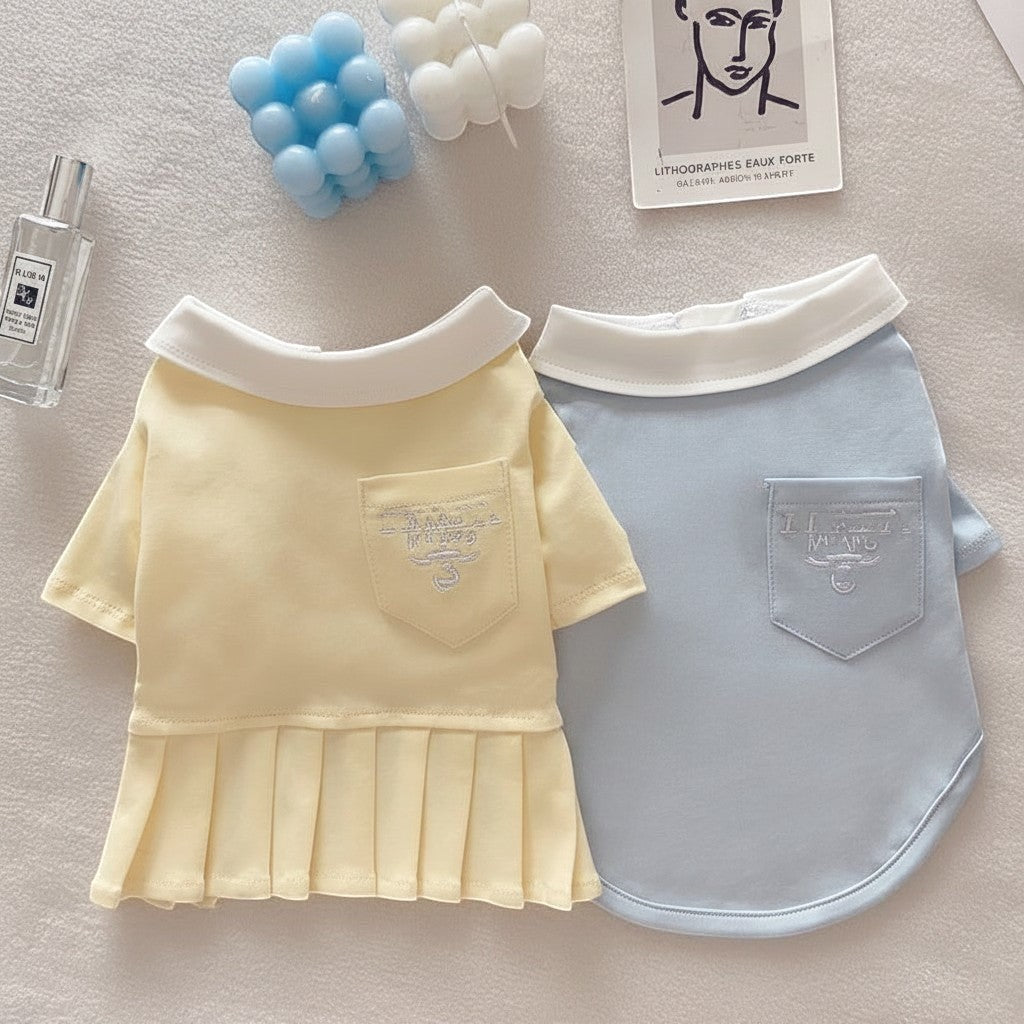 The Spoiled Pet Club yellow pleated dog dress and blue polo shirt in breathable cotton with white collars and pockets.
