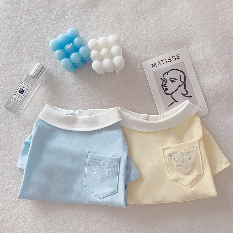 The Spoiled Pet Club cotton polo shirts for dogs in light blue and yellow with white collars and chest pockets.
