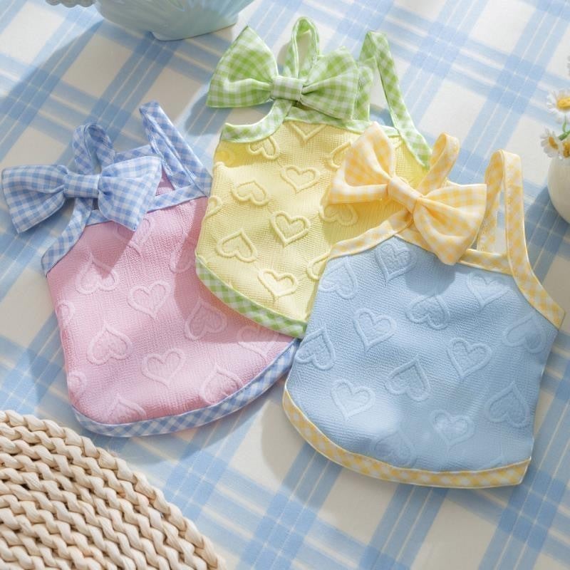 The Spoiled Pet Club pink, yellow, and blue dog tank tops with embossed hearts and gingham bows.