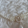 The Spoiled Pet Club Duchess Pearl Cat Collar featuring double-layer white pearls, floral accents, and a crystal charm.