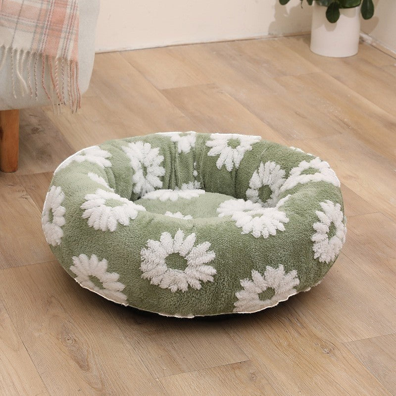 The Spoiled Pet Club round green pet bed with white floral petal pattern, made of soft polyester fiber for cozy comfort.