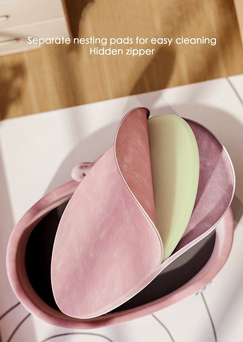 The Spoiled Pet Club Little Haven Bed in pink with removable nesting pads and hidden zipper.