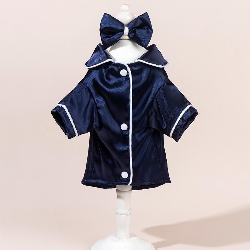 The Spoiled Pet Club navy blue satin pajama shirt with white piping and bow detail. Tailored silhouette.