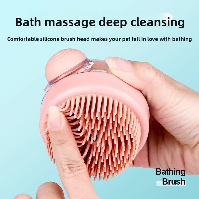 The Spoiled Pet Club pink silicone pet bathing brush with built-in soap dispenser and soft bristles for massage.