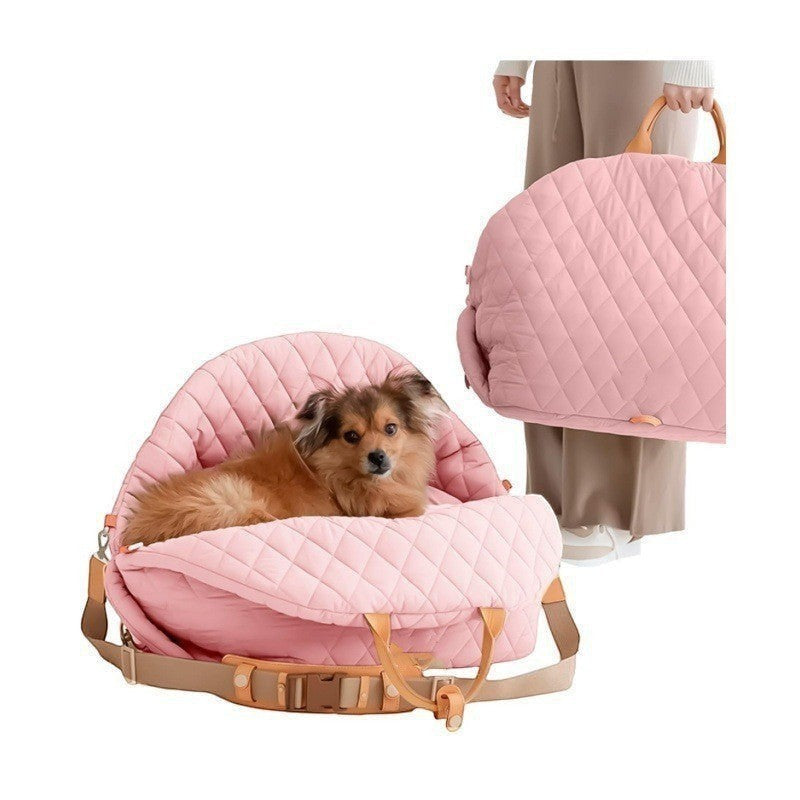 The Spoiled Pet Club pink quilted nylon pet carrier bag used as a portable car seat or hand-carry travel bed