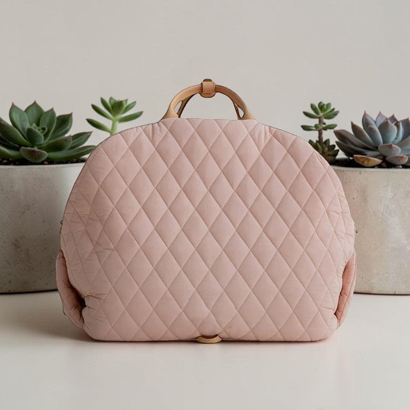 The Spoiled Pet Club pink quilted nylon pet carrier bag with a soft, portable design for comfortable travel.