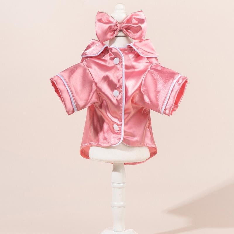 The Spoiled Pet Club pink satin pajama shirt with white piping and matching bow headband. Short sleeves, button front.