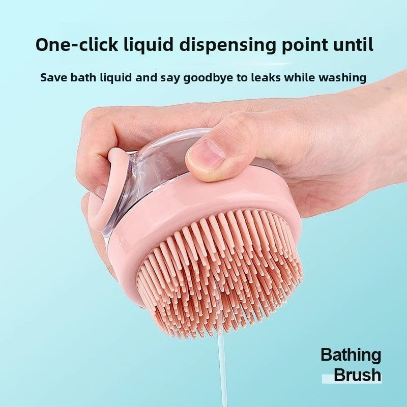 The Spoiled Pet Club pink silicone pet bathing brush with built-in soap dispenser for gentle lathering and massage.