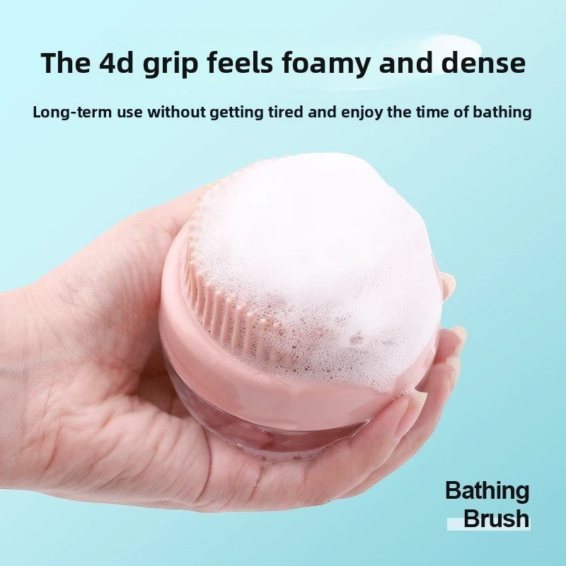 The Spoiled Pet Club pink silicone pet bathing brush with built-in soap dispenser creating rich lather.