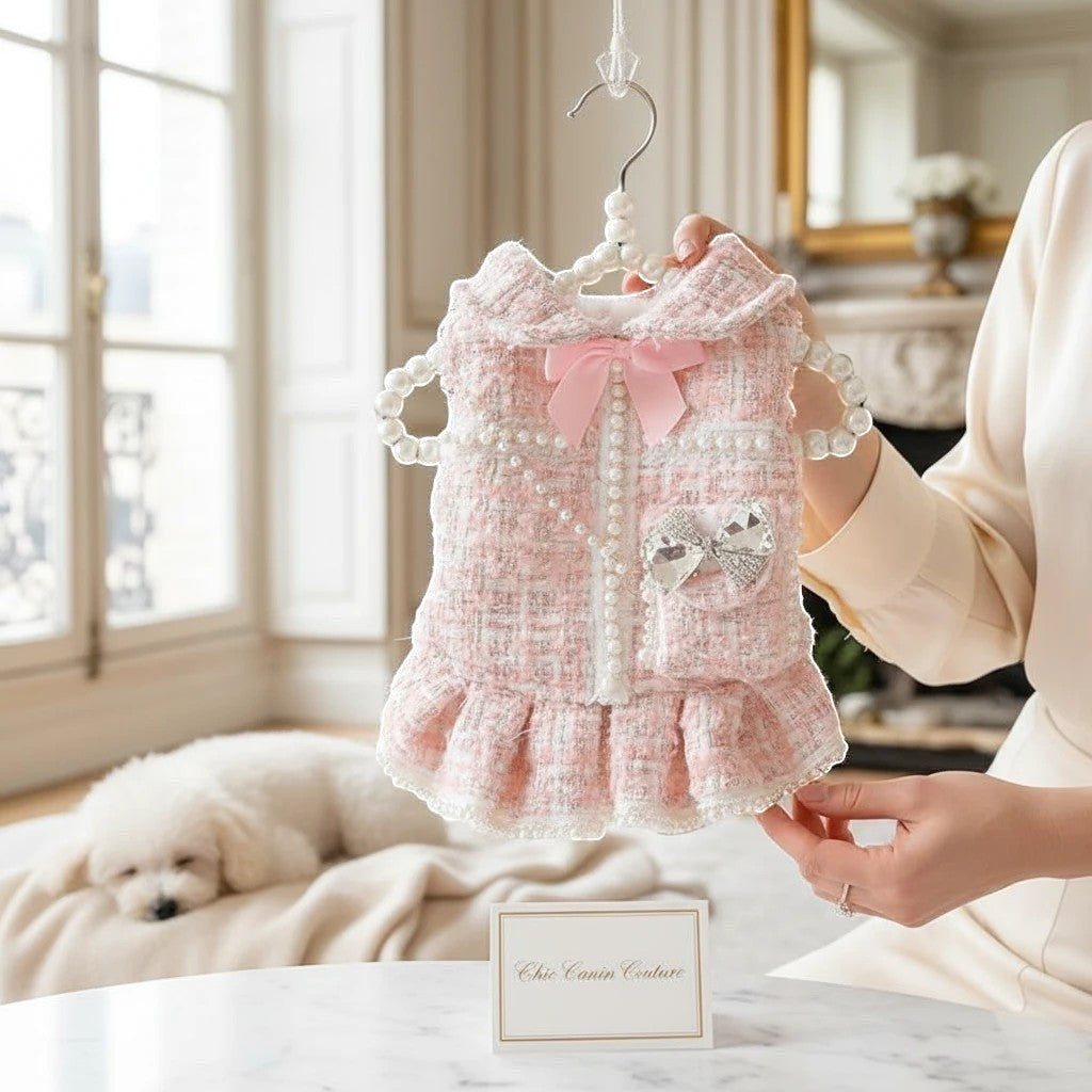 The Spoiled Pet Club Dahlia Darling pink tweed dog dress with pearl trim, bow, and ruffled hem.