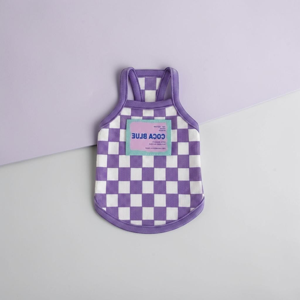 The Spoiled Pet Club purple and white checkered dog tank top made from soft acrylic fiber with a branded patch.