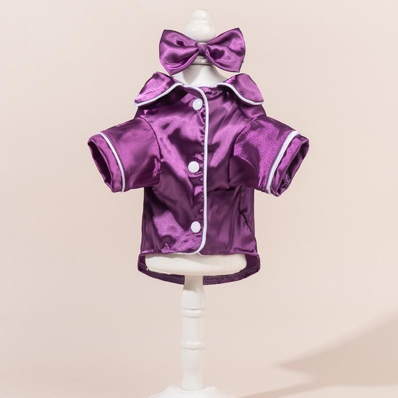 The Spoiled Pet Club purple satin pajama shirt with white trim and bow detail. Tailored silhouette, smooth finish.
