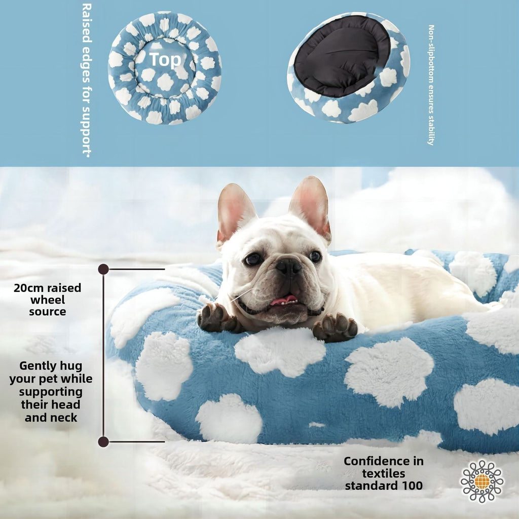 The Spoiled Pet Club round blue pet bed with white cloud pattern, featuring raised edges for head and neck support.