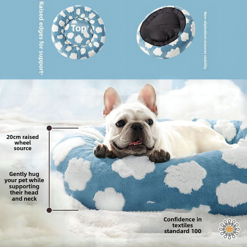 The Spoiled Pet Club round blue pet bed with white cloud pattern, featuring raised edges for head and neck support.