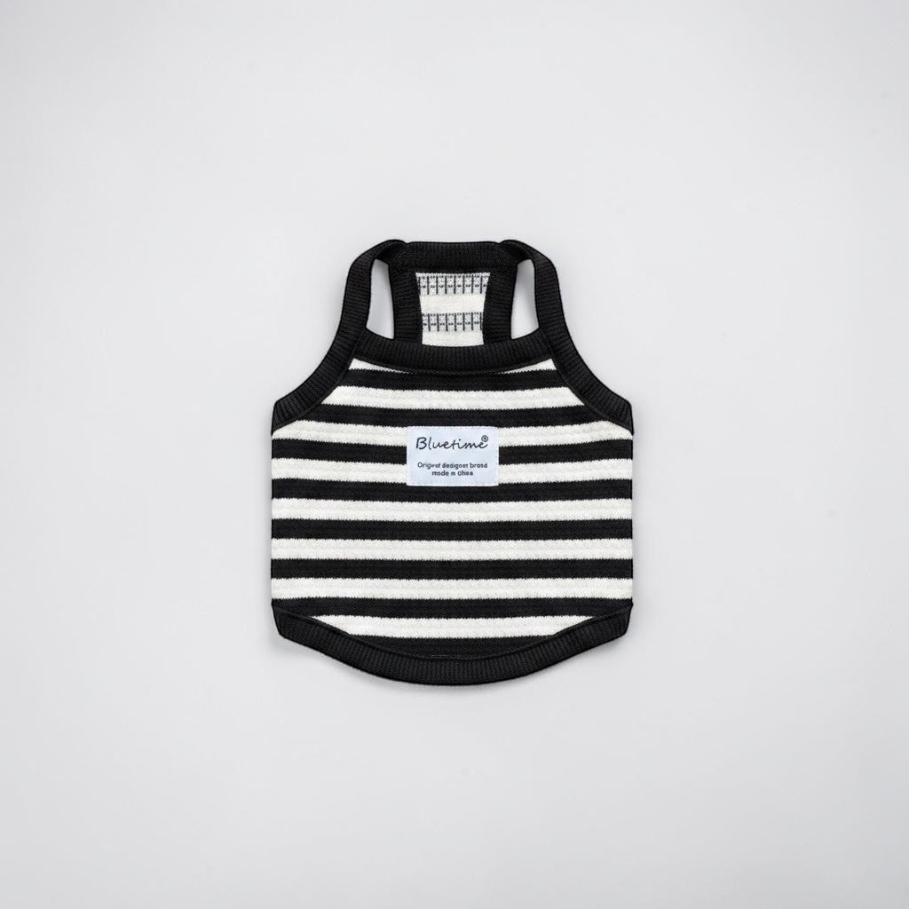 The Spoiled Pet Club black and white striped acrylic fiber dog tank top with a branded patch on a light background.
