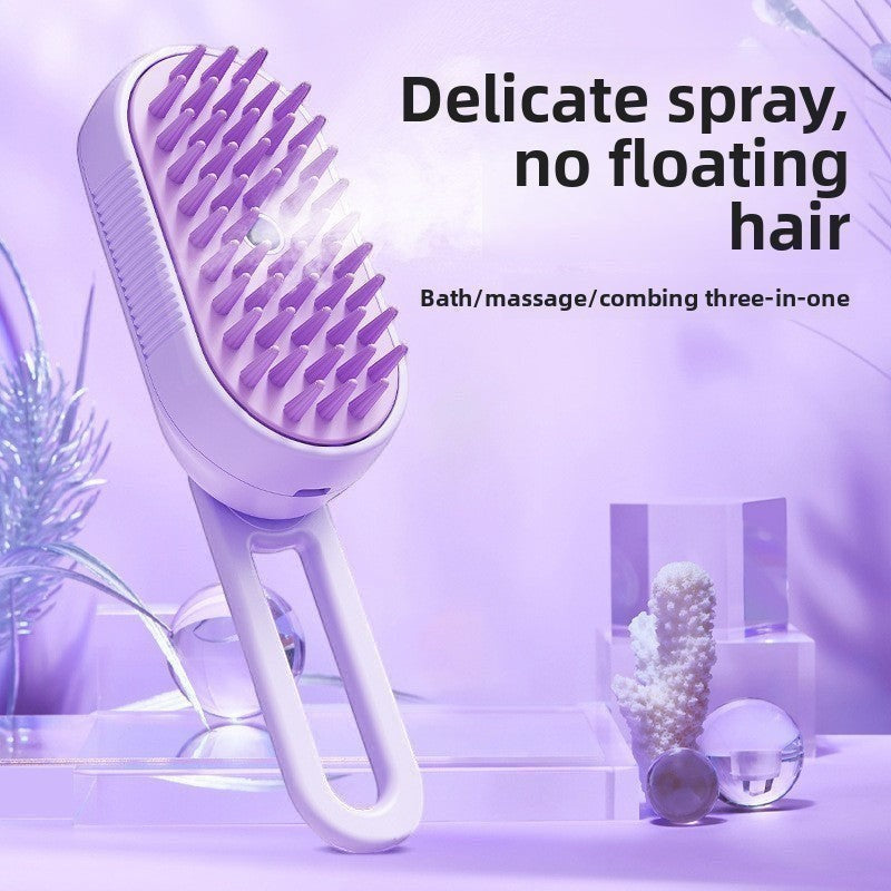 The Spoiled Pet Club Velvet Paw Spa Brush, a purple silicone pet grooming brush with a built-in spray function for bathing and massaging.