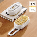 The Spoiled Pet Club Velvet Paw Spa Brush, white plastic pet grooming brush with soft silicone bristles and built-in soap mister