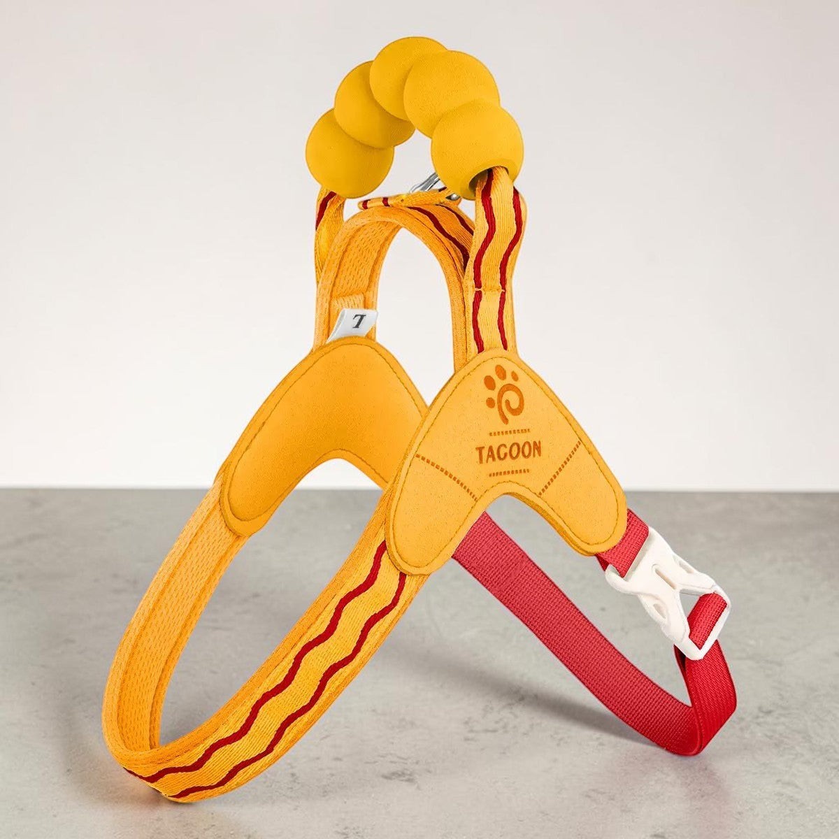The Spoiled Pet Club yellow Astor dog harness with a cloud-shaped sponge handle and adjustable polypropylene straps.