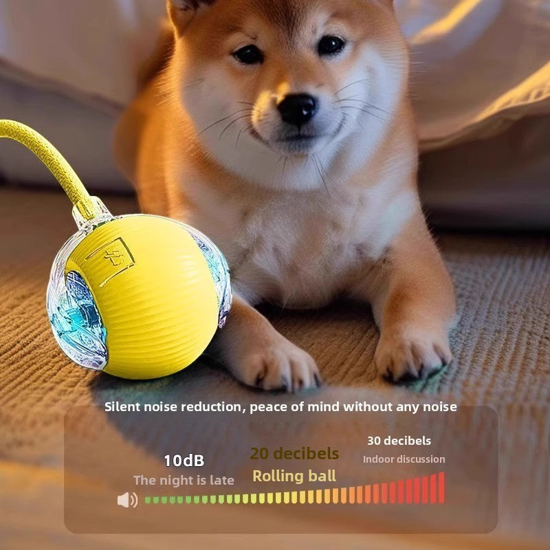 The Spoiled Pet Club yellow interactive rolling dog toy ball with quiet movement next to a Shiba Inu puppy
